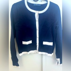 Zara knitwear with white trim endings and pearl buttons